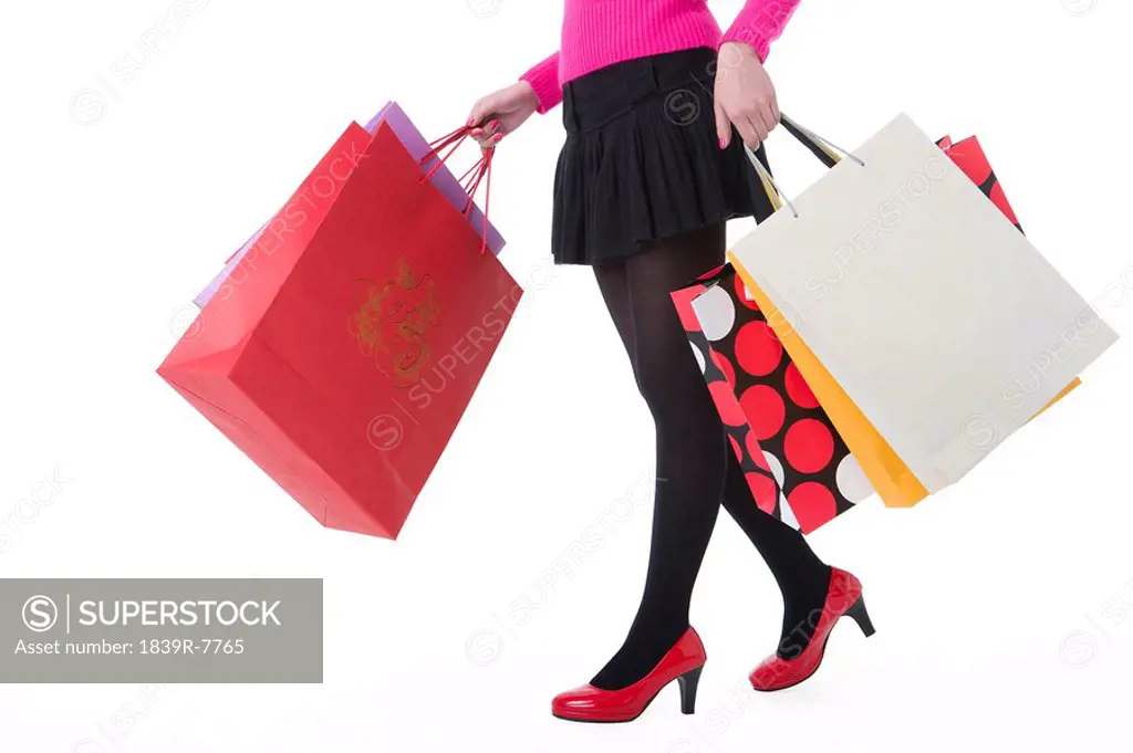 View of a woman holding her shopping bags