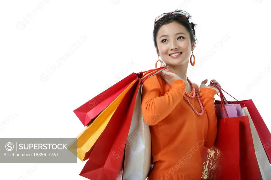 Young woman holding her shopping bags