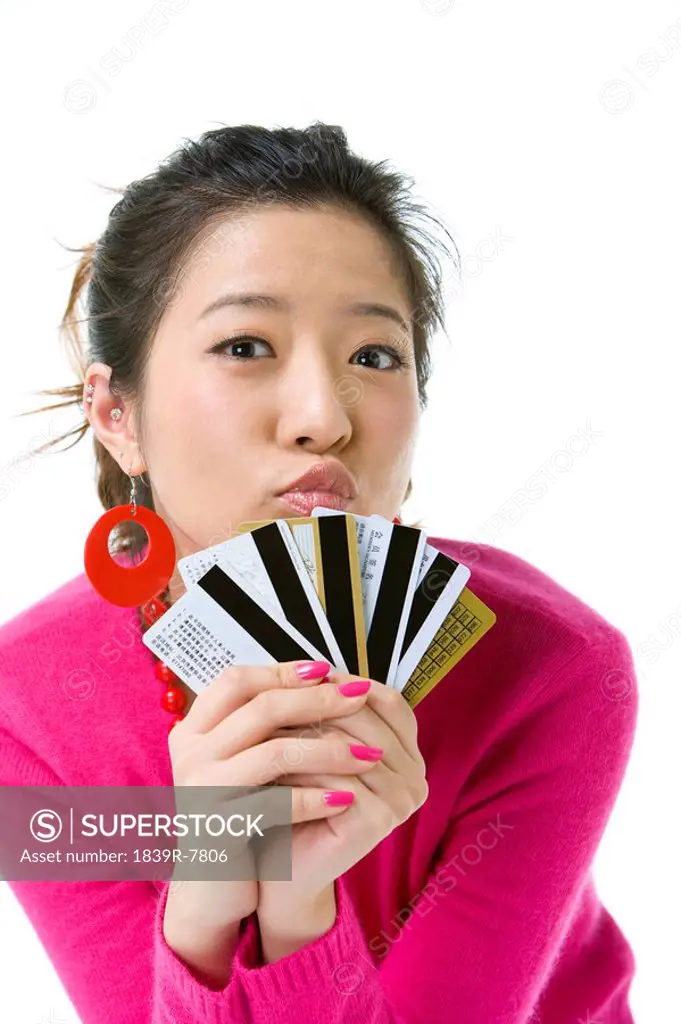 Young woman with several credit cards