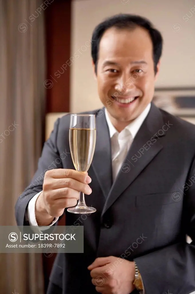 Man holding a glass of champagne