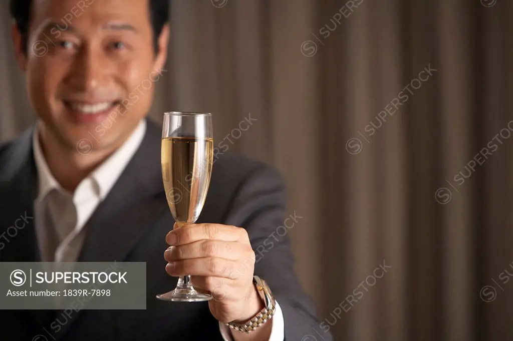 Man holding a glass of champagne