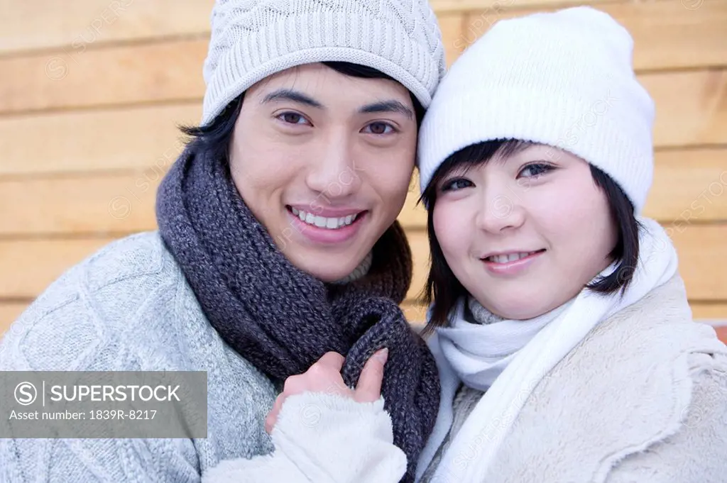 Young couple smiling into the camera