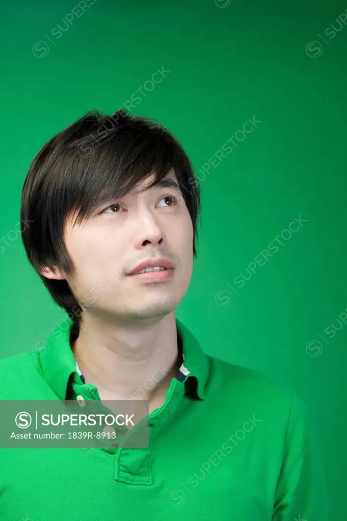 Man in green on green background