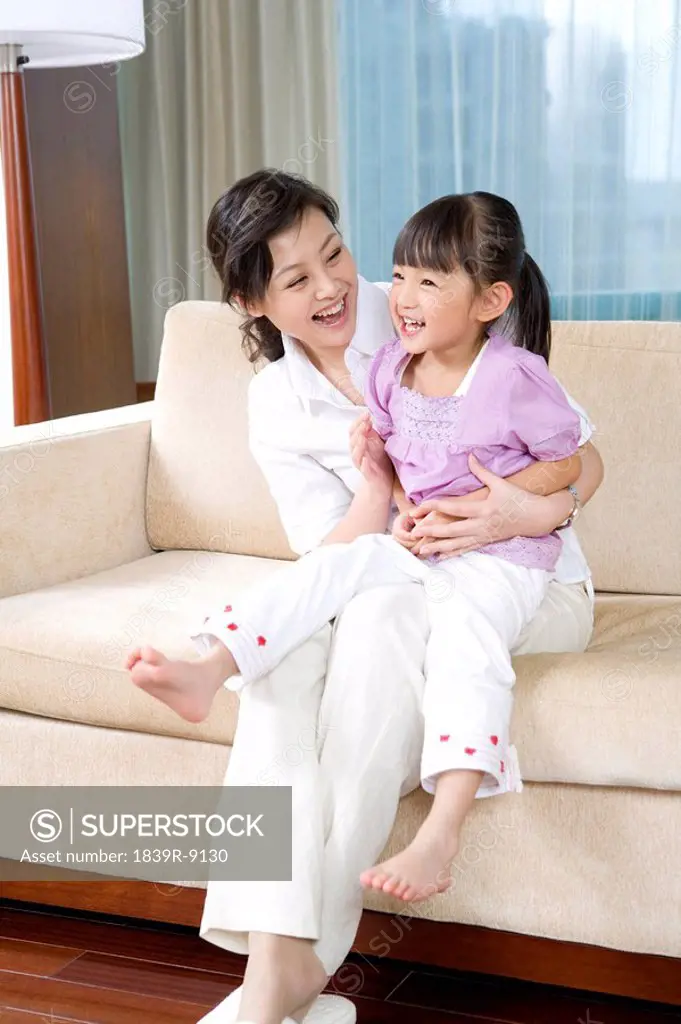Mother and daughter on couch