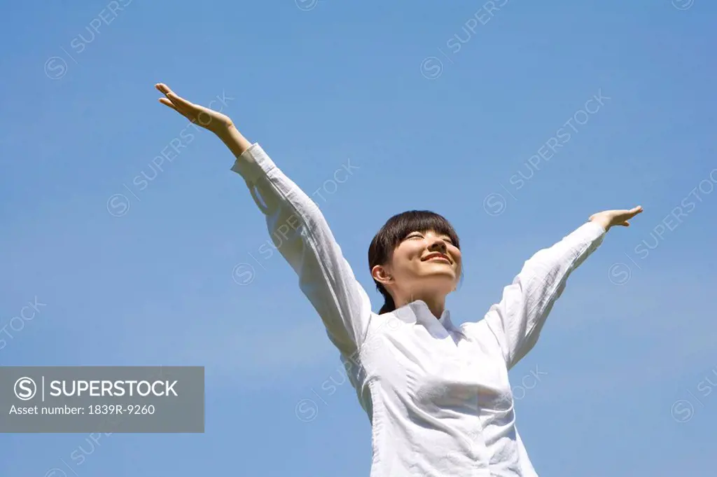 Asian woman in front of sky