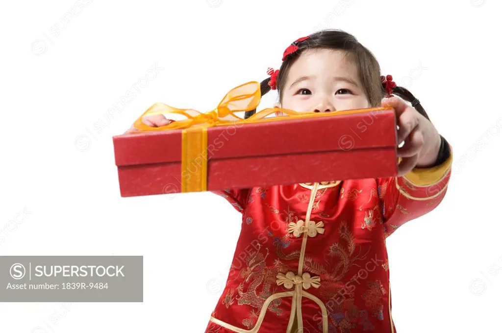 Young girl holding gift box