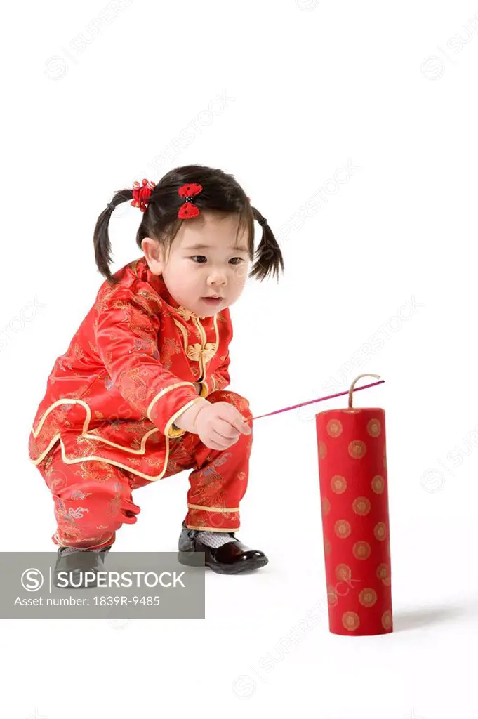 Young girl playing firecrackers