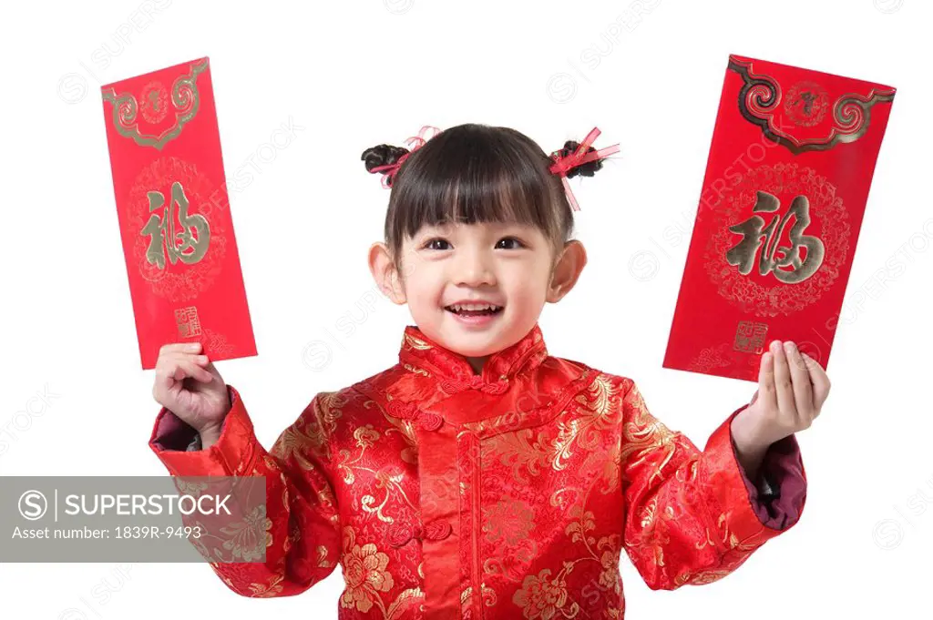 Young girl holding Chinese New Year red envelop