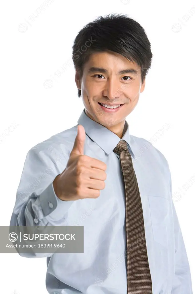 Young Businessman showing thumb up