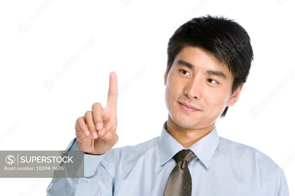 Young Businessman pointing by finger