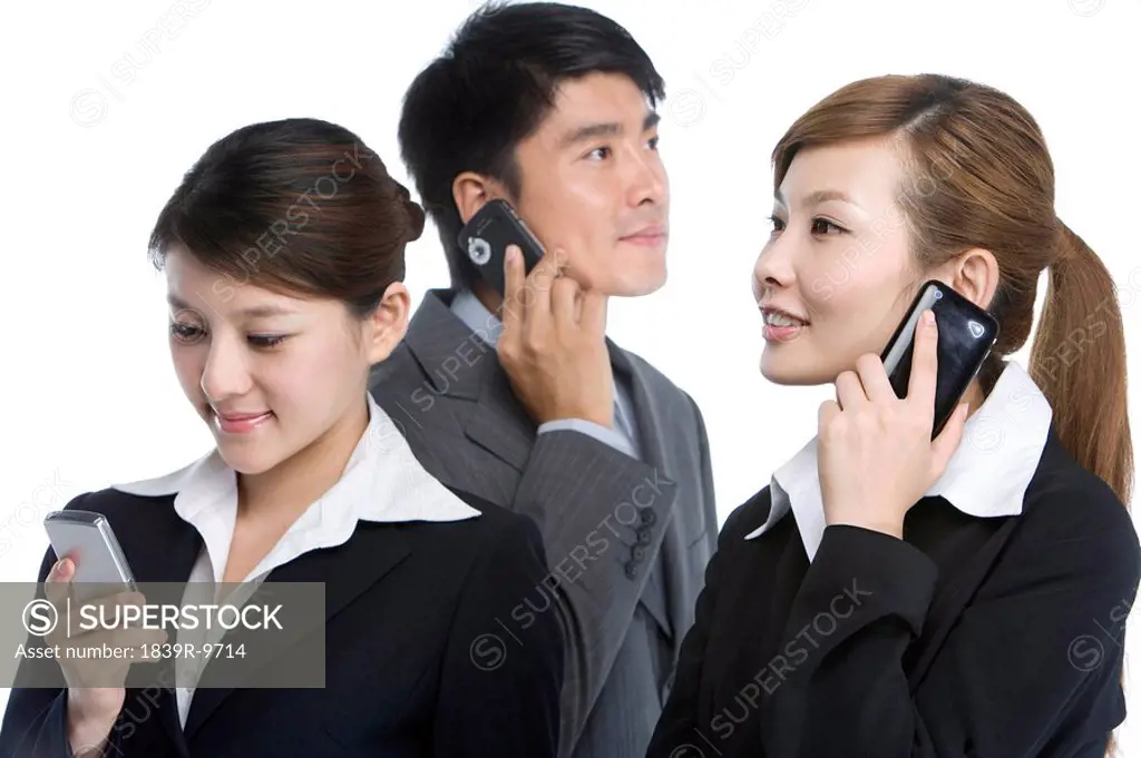 Businessmen using cell phones