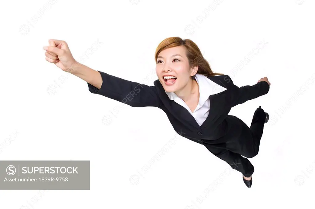 Young businesswoman pumping fist