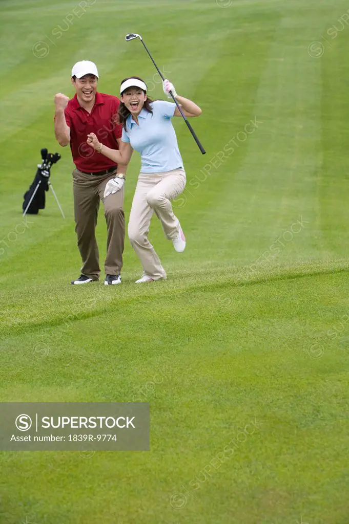 Two Golfers Celebrate a Great Shot
