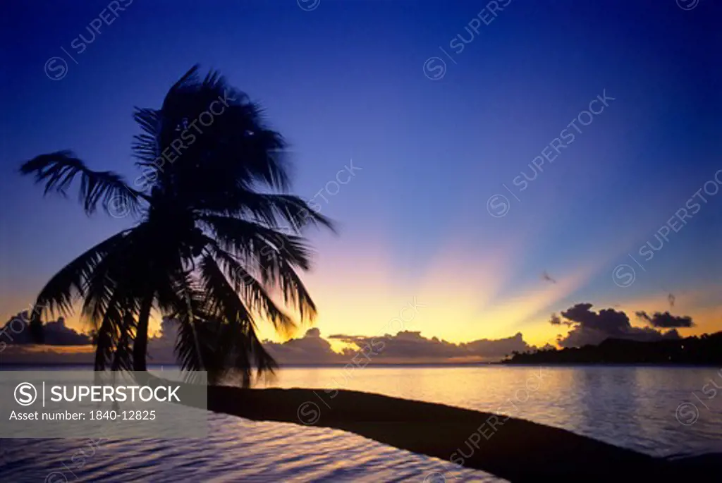 Sunset from Matira Beach on the island of Bora Bora, Society Islands, French Polynesia.