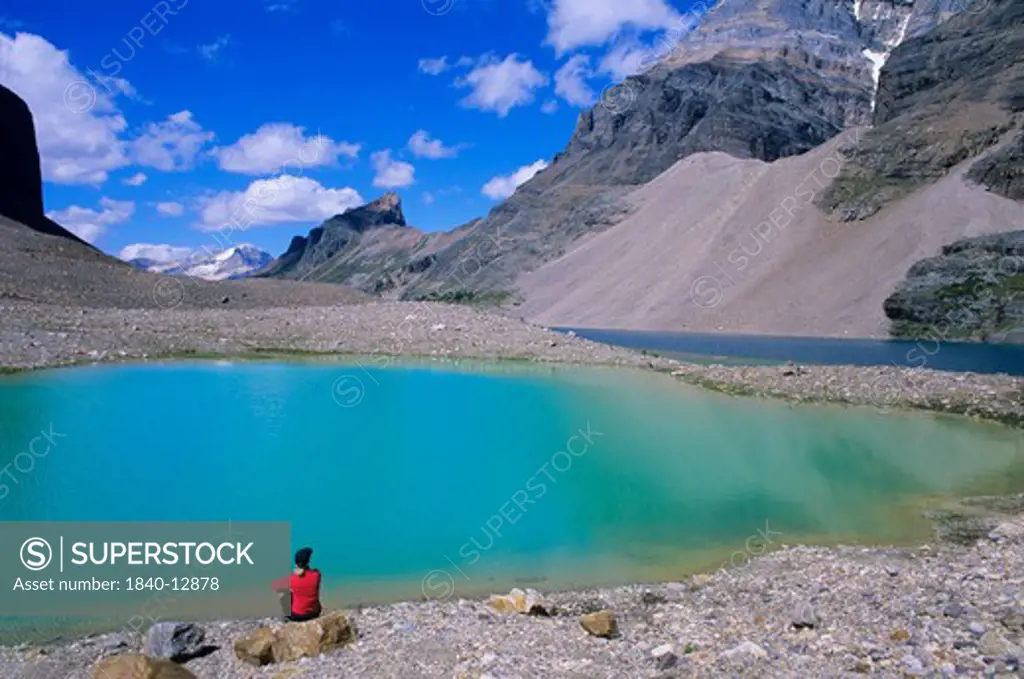 On the shore of little Lake Oesa with pointed summit of Wiwaxy Peak in the background. Lake O'Hara area, Yoho National Park, British Columbia, Canada.