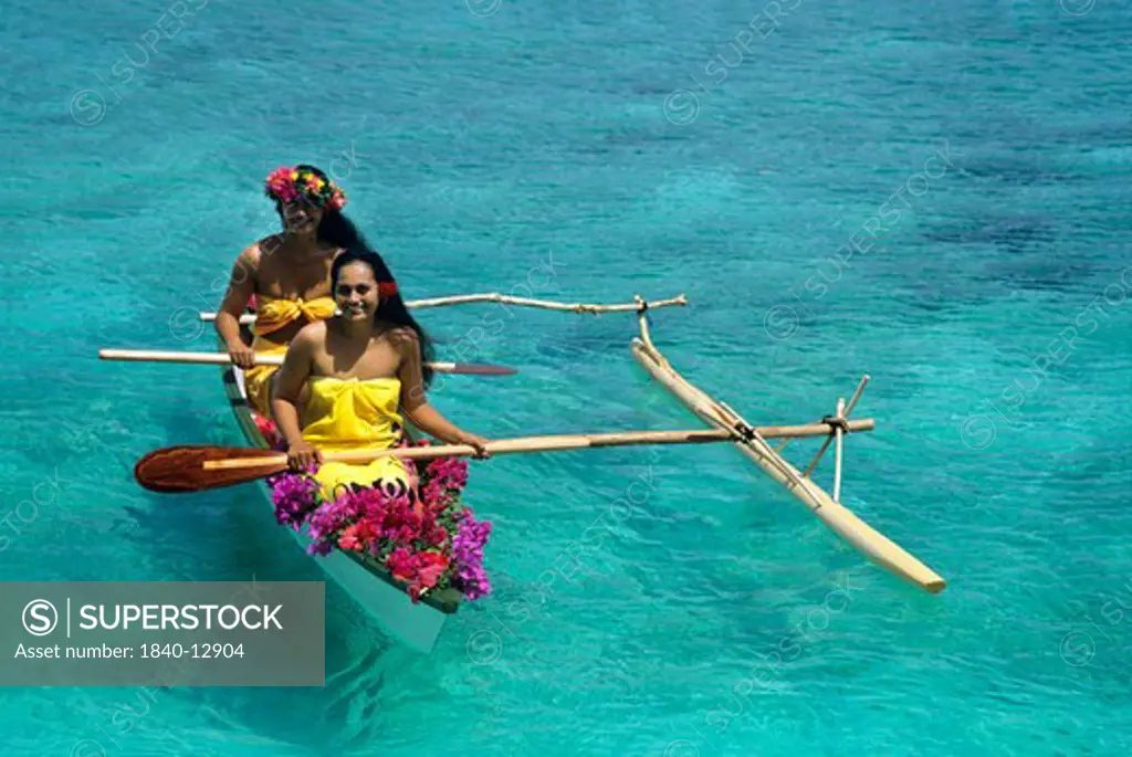 Outrigger canoe in the lagoon on the island of Huahine in the Society Islands of French Polynesia.