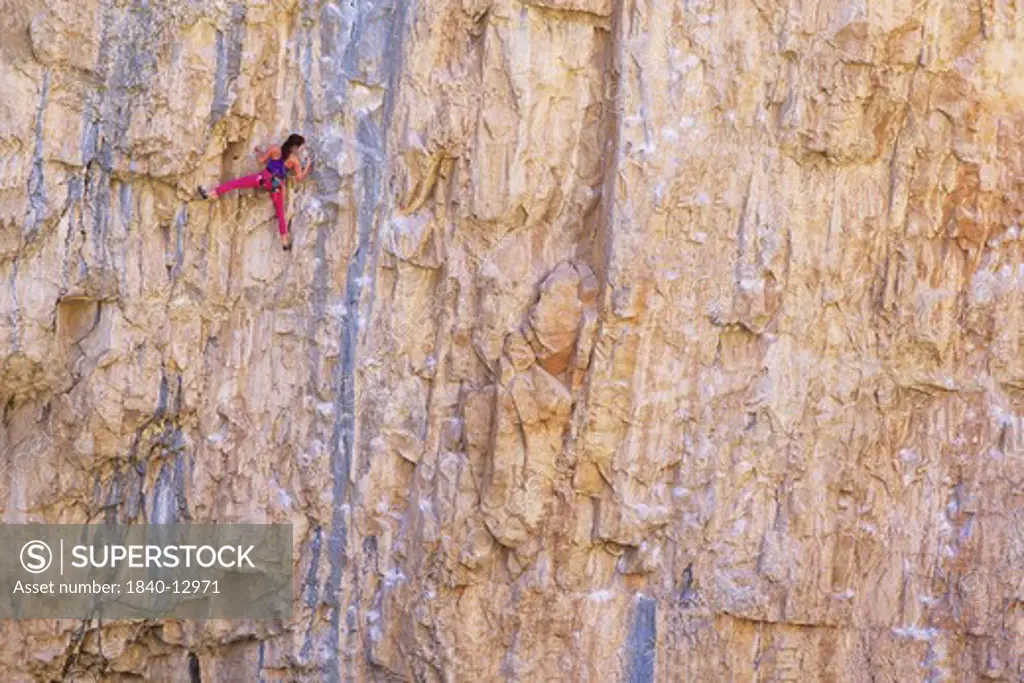 Woman rock climbing at Rifle, Colorado.