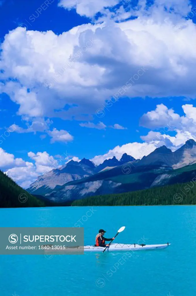 Kayaking on Mistaya Lake along the Icefields Parkway in the Canadian Rockies of Banff National Park, Alberta, Canada.