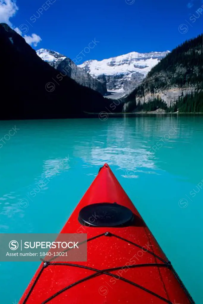 Kayak on Lake Louise below Mount Victoria in the Canadian Rockies; Banff National Park; Alberta, Canada