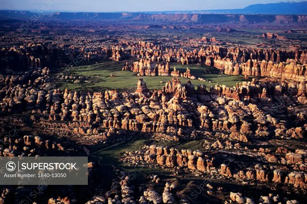 Aerial view of Chesler Park with Bridger Jack Mesa in the background and the Abajo Mountains in the upper right corner. View is looking east. Needles District, Canyonlands National Park, Utah.