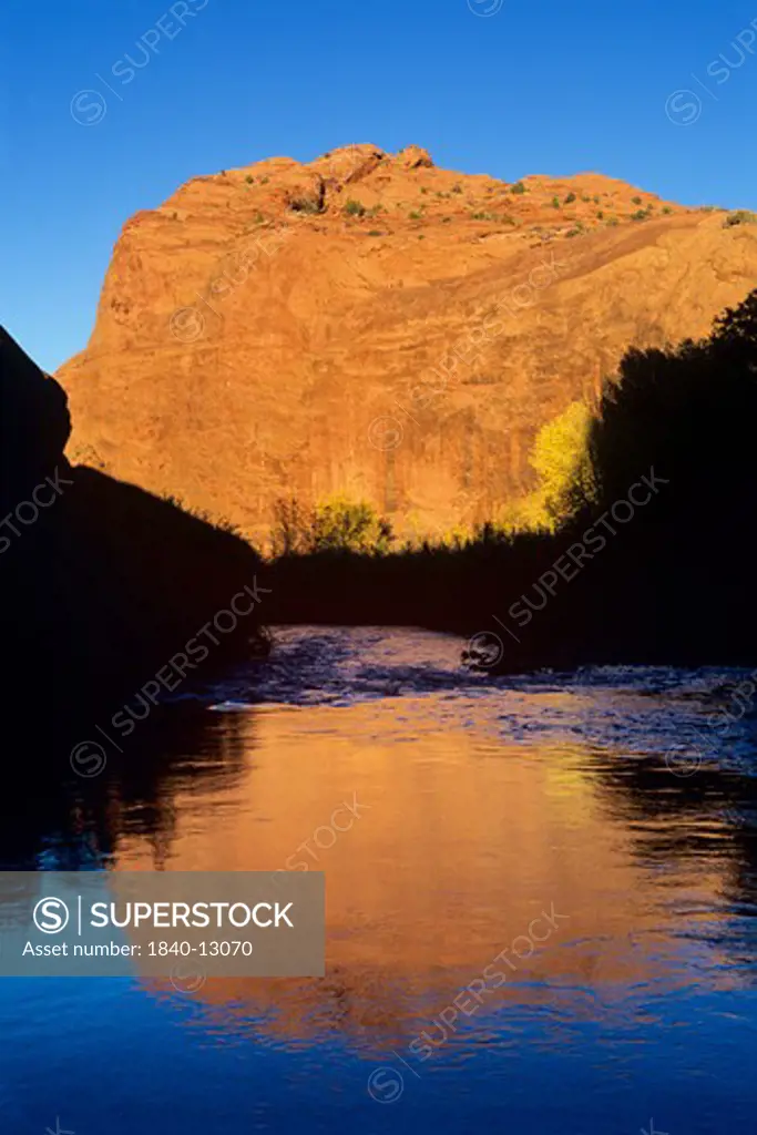 Evening reflections along the Escalante River above its confluence with The Gulch, Grand Staircase Escalante National Monument, Utah.