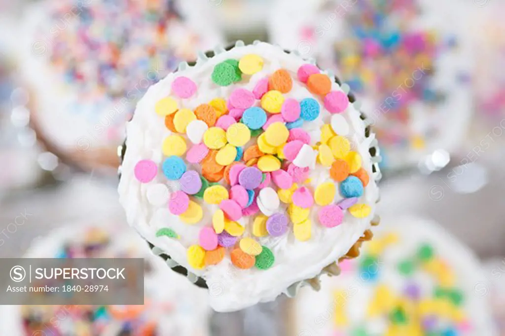 Cupkakes sprinkled with colorful decorations for a celebration