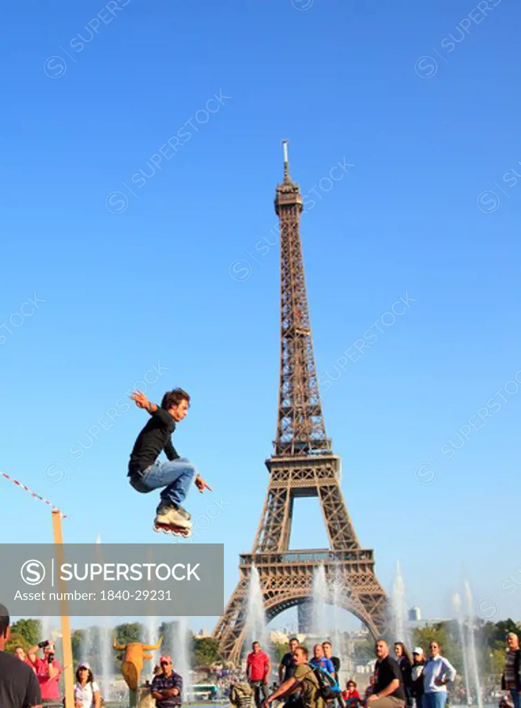 Roller Skater jumping  in front of the Eiffel Tower. Paris
