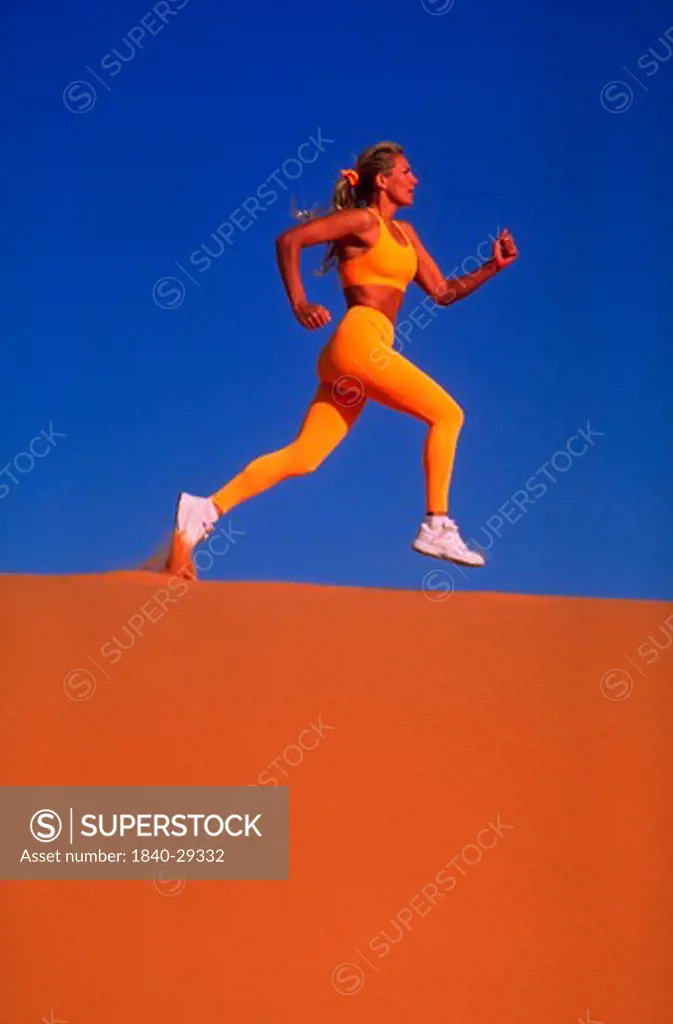Copyright James Kay.  Runner in Coral Pink Sand Dunes State Park in Southern Utah.  We have extensive files on all of the national parks and other areas in southern Utah and the Colorado Plateau.