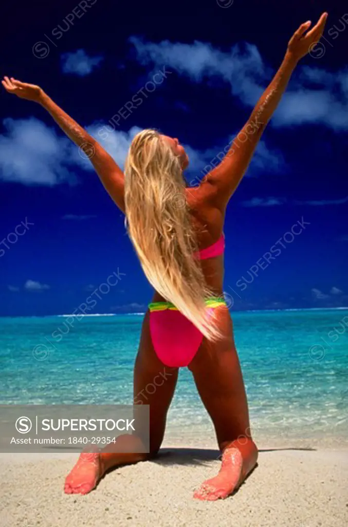 Woman on Matira Beach, Bora Bora, Society Islands, French Polynesia, South Pacific.