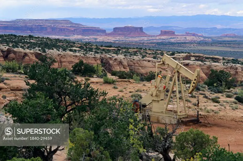 Oil well on Utah state land section on rim of Long Canyon less than 1/4 mile from Deadhorse Point State Park and 3 miles from Canyonlands National Park, Utah.