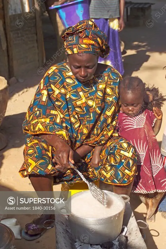 Mother & Child Cooking Traditional Food