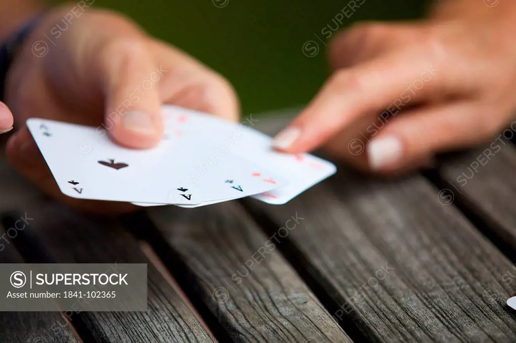 Senior couple playing cards, close_up