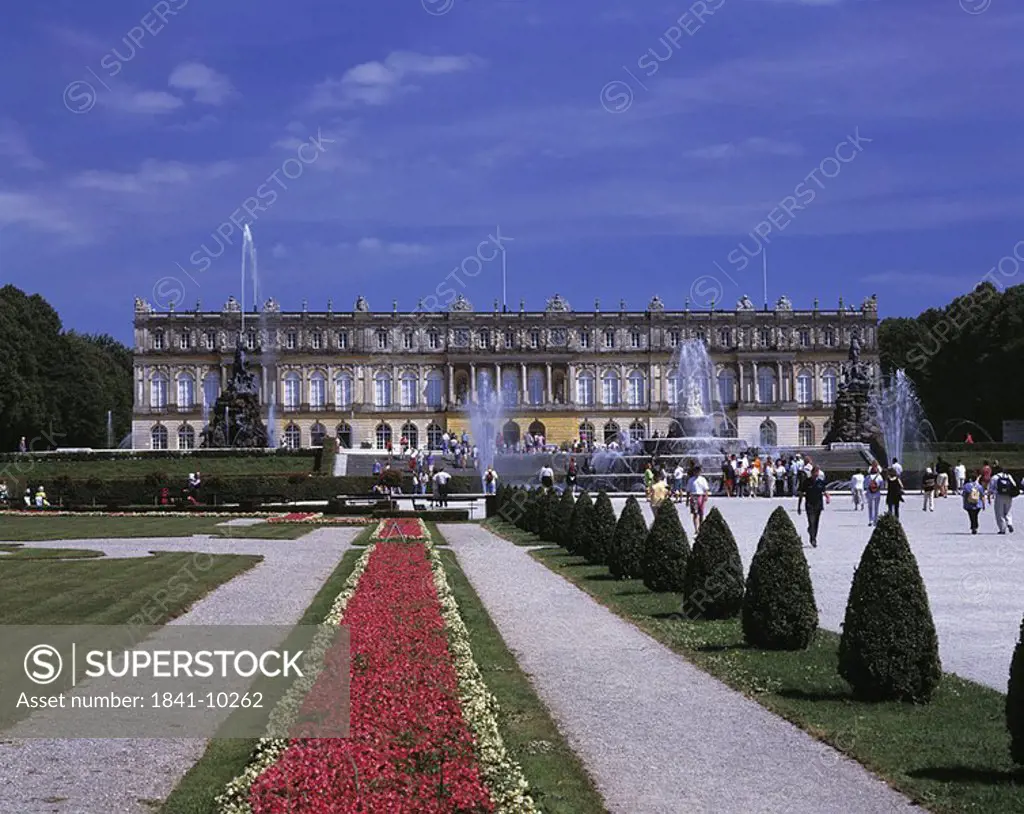 Tourists at castle, Herrenchiemsee Castle, Herreninsel, Chiemsee, Bavaria, Germany