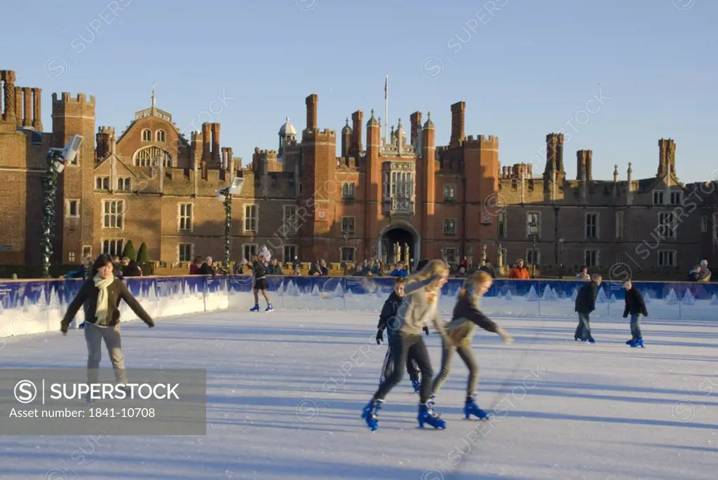 People ice_skating in front of palace, Hampton Court Palace, Hampton, London, England