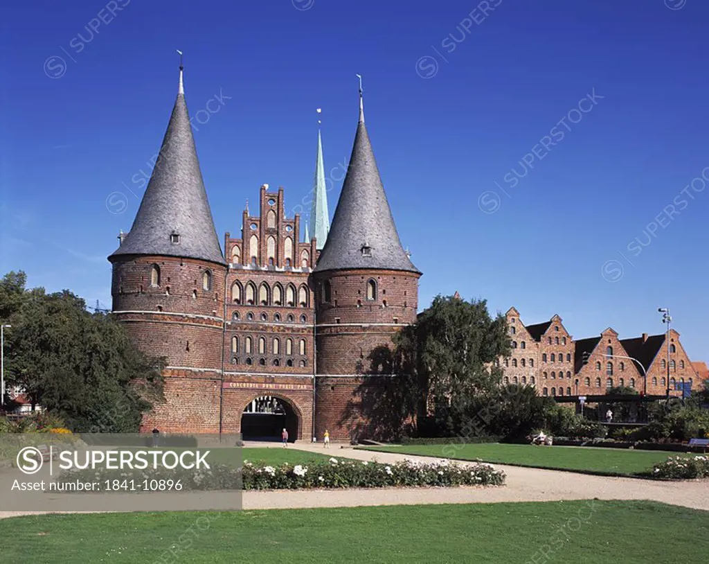 Lawn in front of castle under clear blue sky