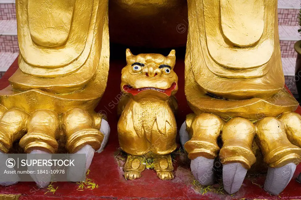 Golden lion guarding entrance to Sam Poh Temple
