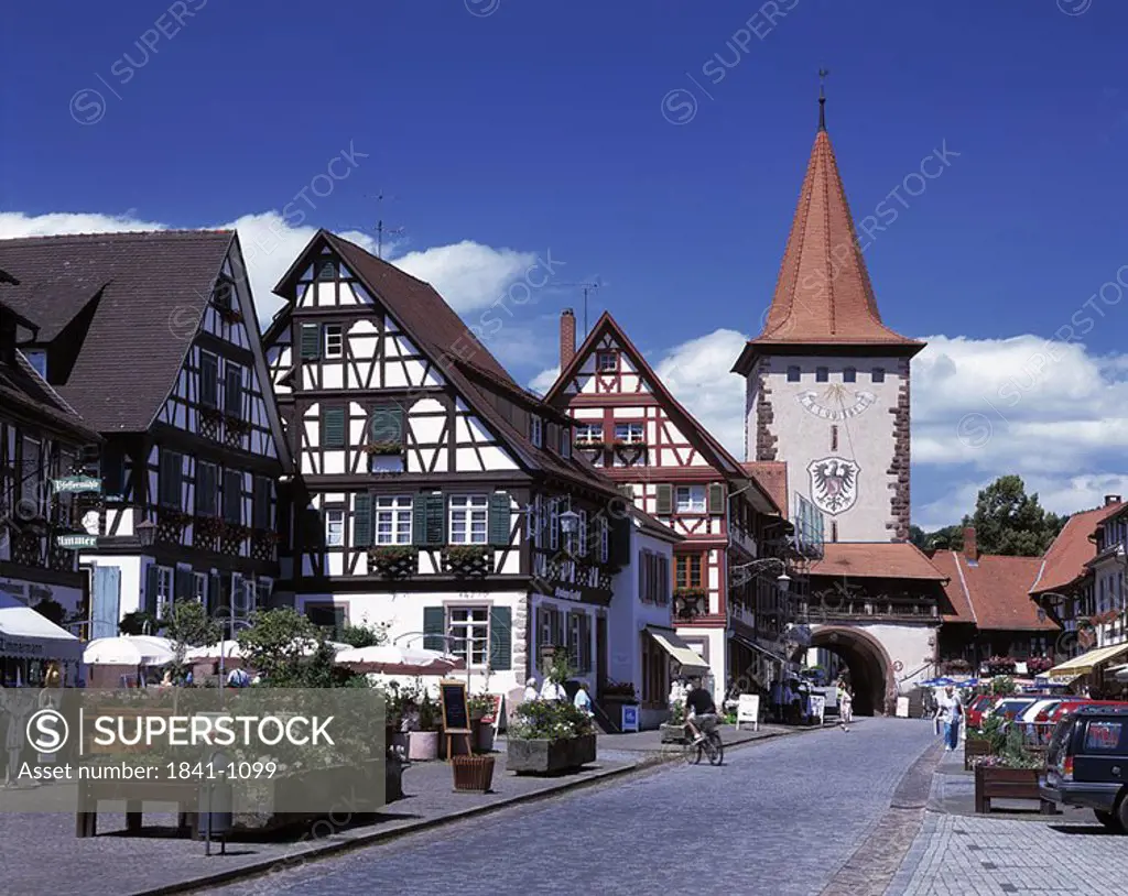 People on street leading to archway, Black Forest, Baden_Wurttemberg, Germany
