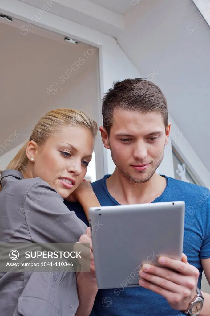 Young couple with ipad