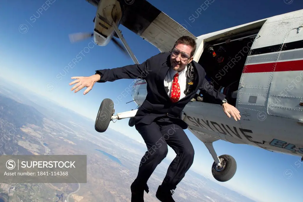 Businessman getting off airplane
