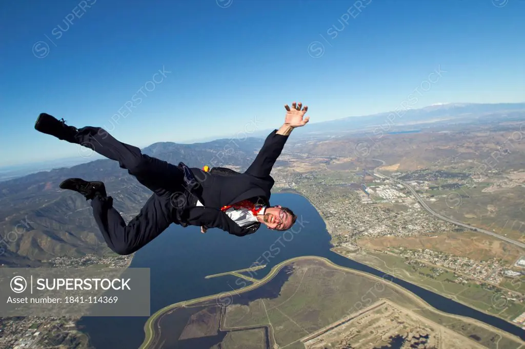Businessman falling from the sky