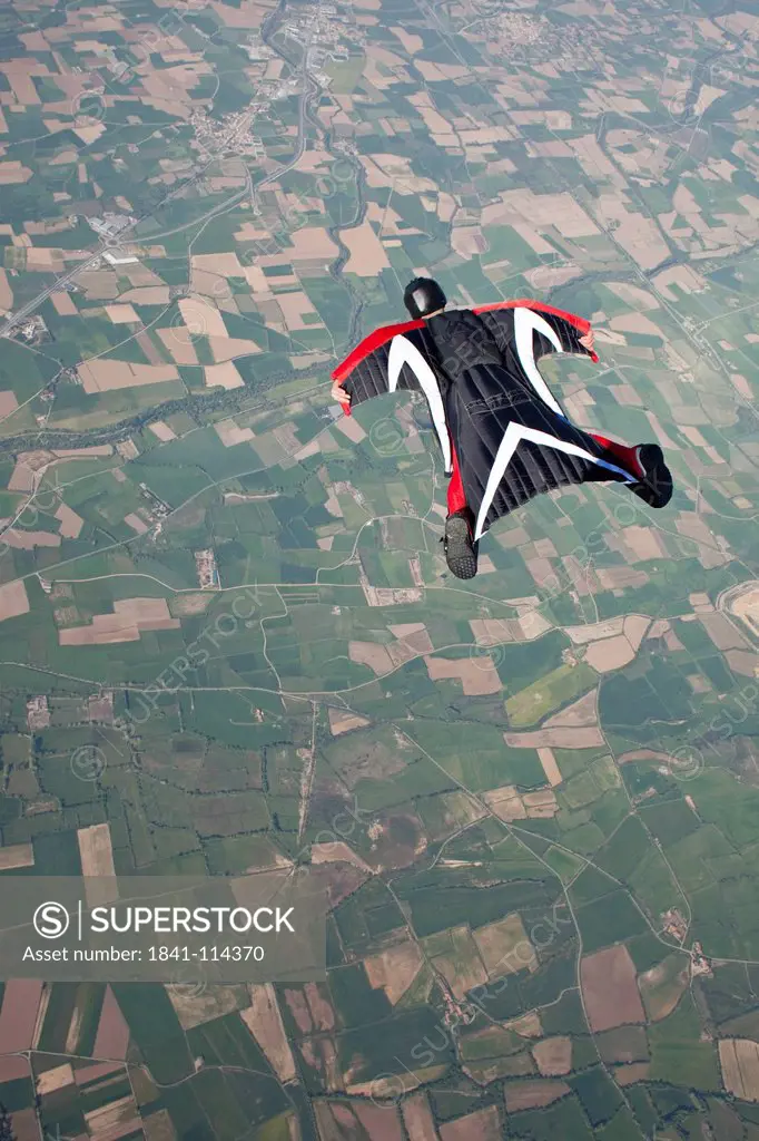 Skydiver wearing wingsuit in the air