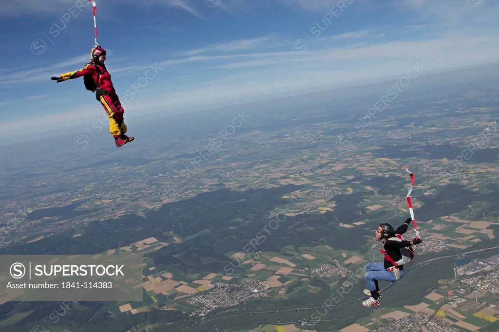 Two skydivers in the air