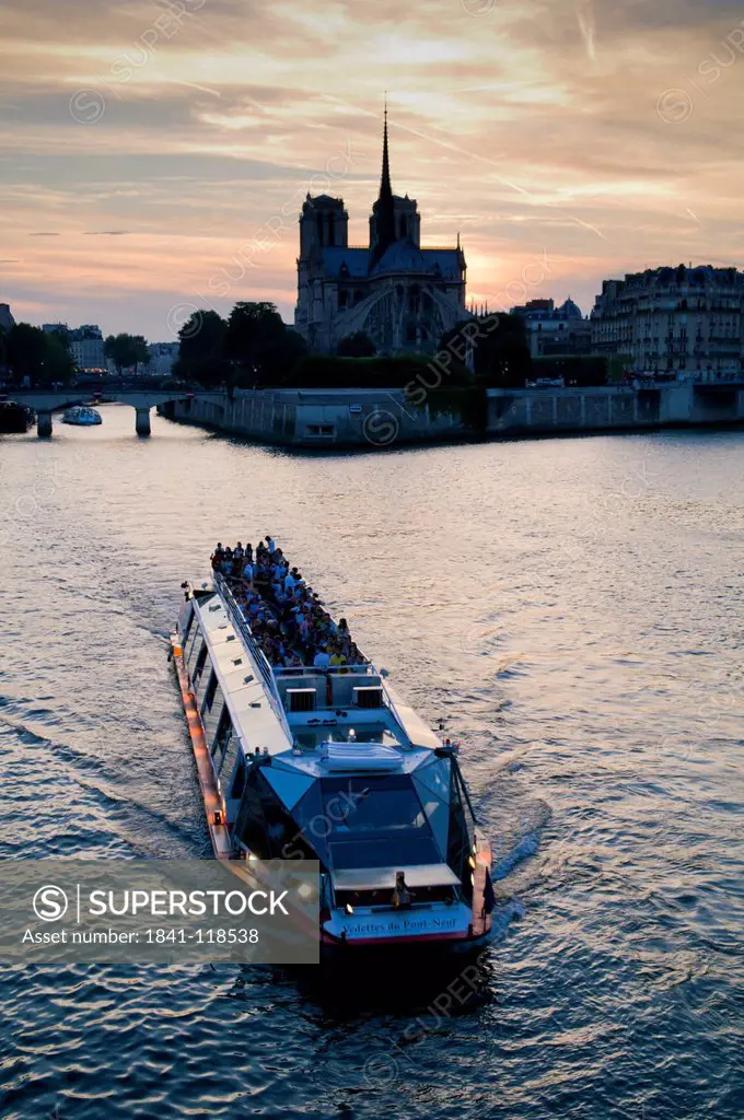 Notre Dame and excursion boat on river Seine, Paris, France, Europe