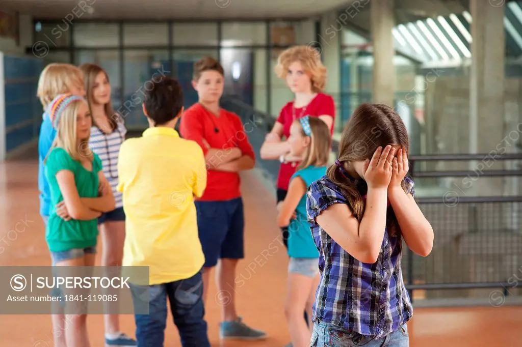 Girl is being bullied group of schoolchildren