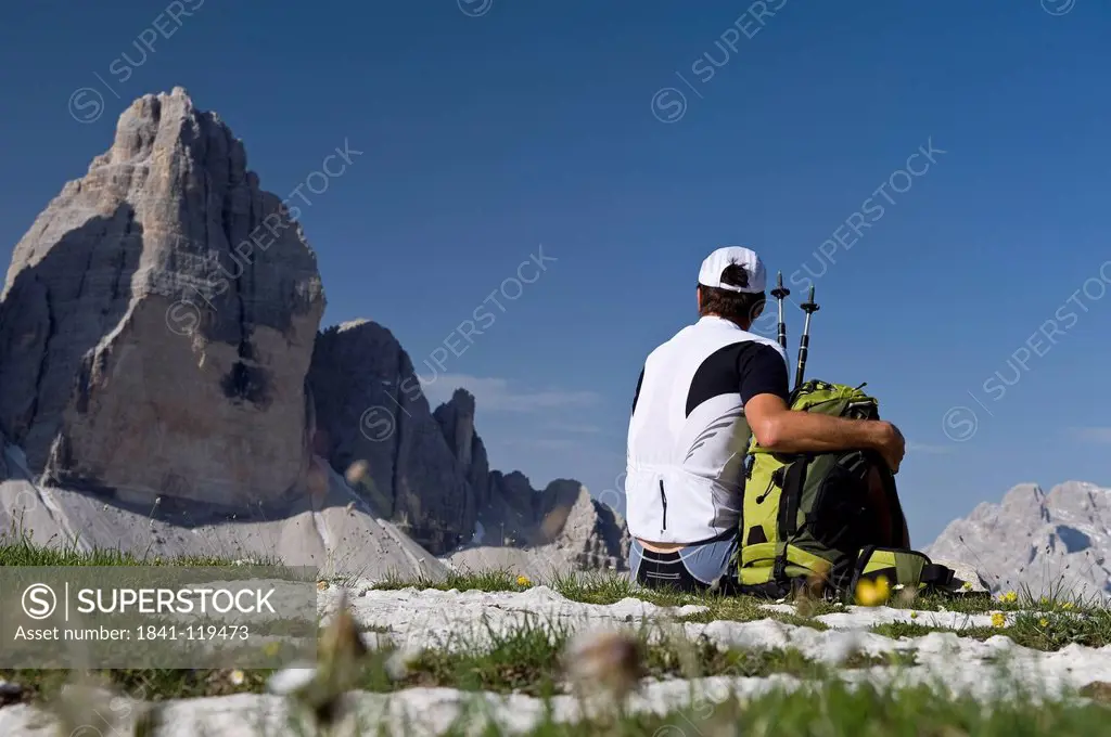 Hiker in front of Tre Cime di Lavaredo, Dolomites, South Tyrol, Italy