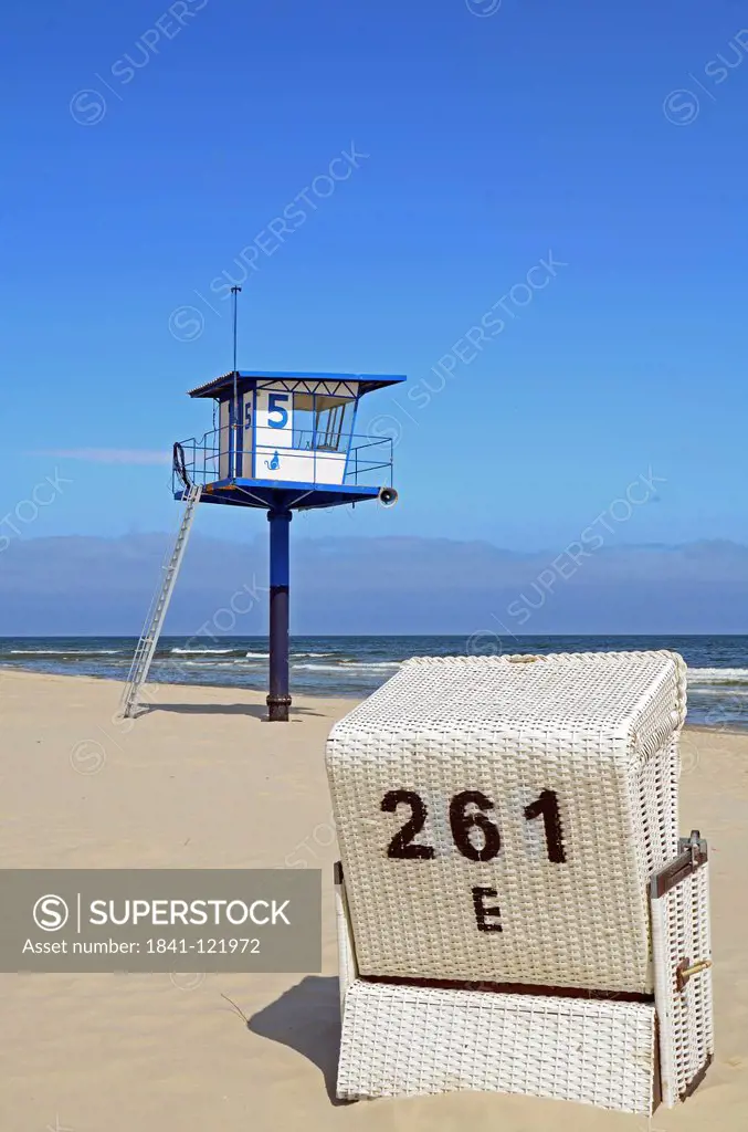 Beach chair and lifeguard hut on the beach of Heringsdorf, Usedom, Germany