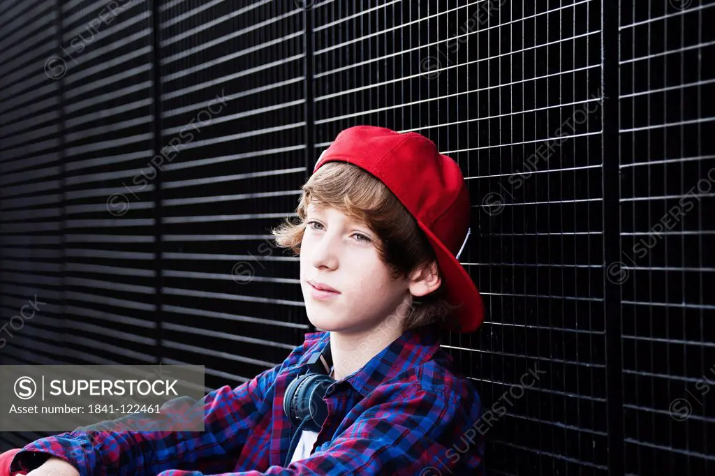 Boy wearing red baseball cap