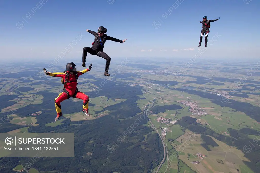 Three parachutists in the air, Bavaria, Germany