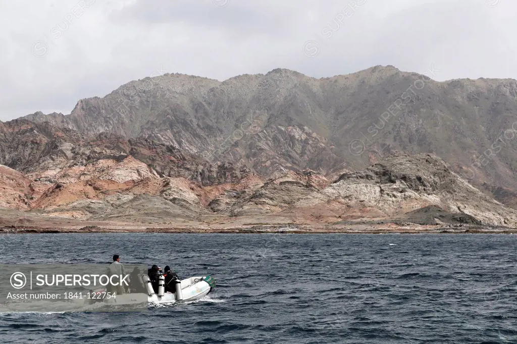 Divers on a boat, Khuriya Muriya Islands, Oman, Indian Ocean