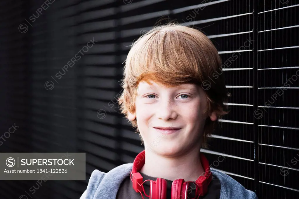 Smiling redheaded boy, portrait